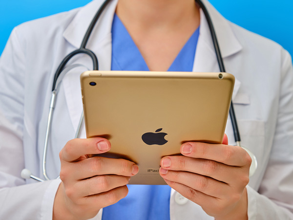 Nurse looking at an iPad
